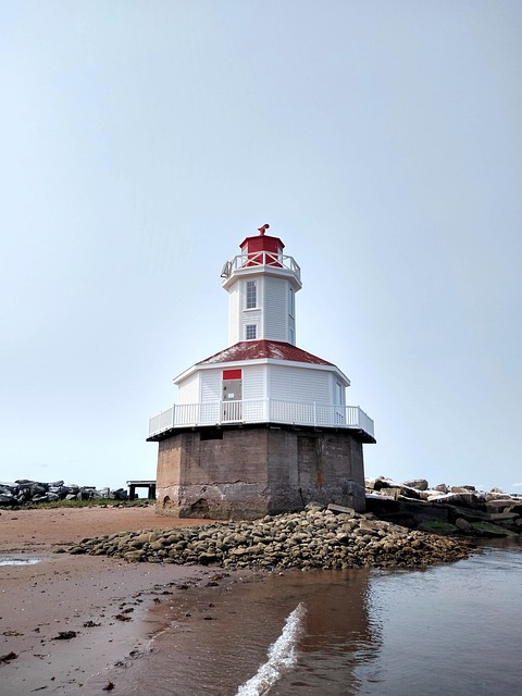 Prince Edward Island red sand beach and rolling green hills in summer